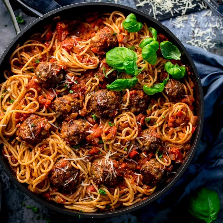 Square image of Spaghetti and meatballs in a pan