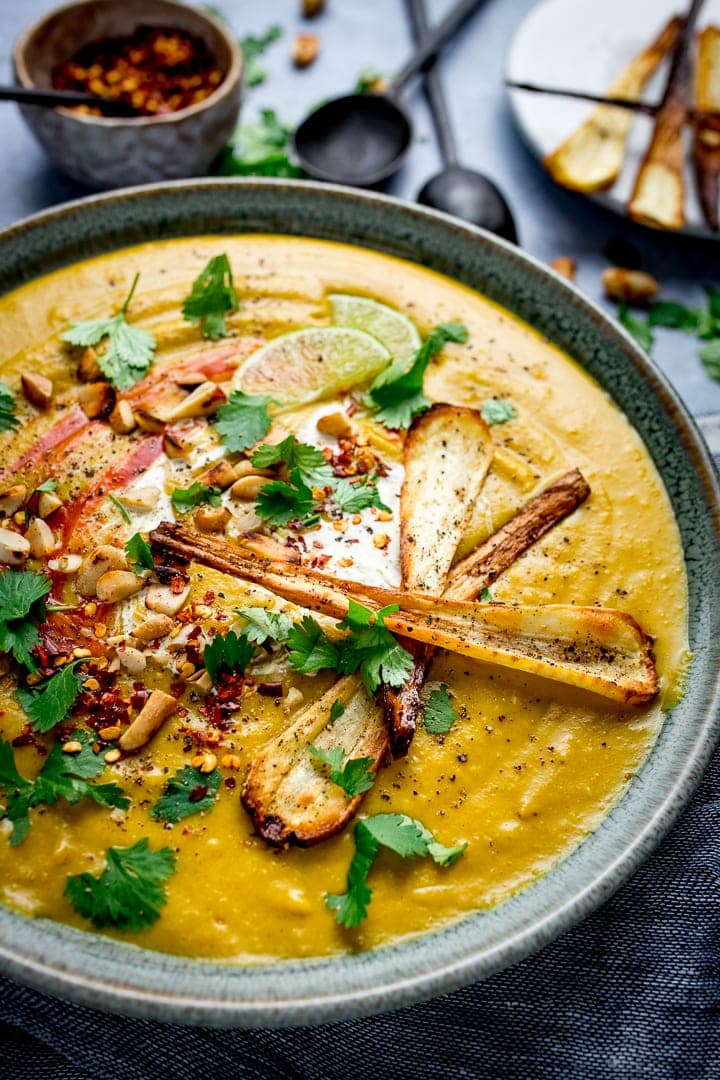 Close up image of parsnip and sweet potato soup with parsnip and coriander toppings