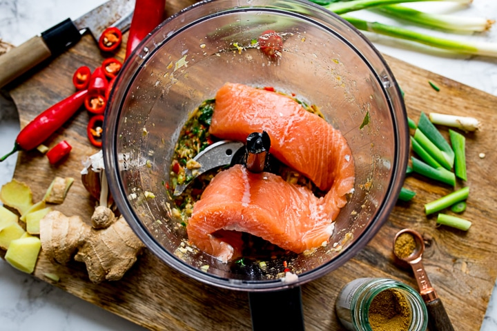 mixture for Thai fishcakes in a food processor with fresh salmon fillets