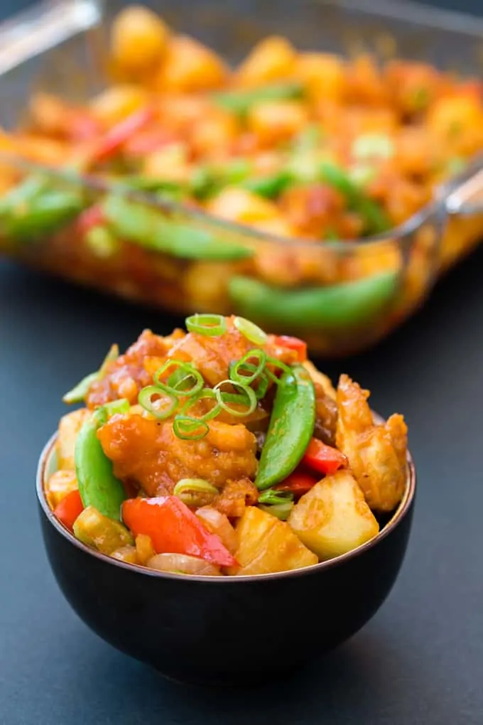 Baked Sweet and Sour Chicken - a healthier, veg-packed version of the Chinese classic. Tastes amazing and ready in less than 30 mins!