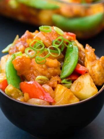 Baked Sweet and Sour Chicken - a healthier, veg-packed version of the Chinese classic. Tastes amazing and ready in less than 30 mins!