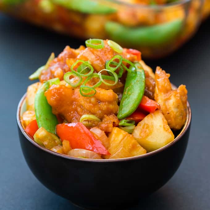 Baked Sweet and Sour Chicken - a healthier, veg-packed version of the Chinese classic. Tastes amazing and ready in less than 30 mins!