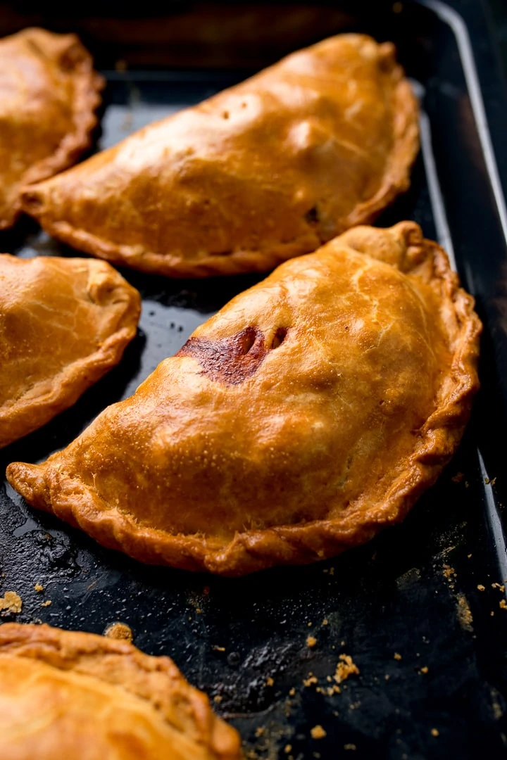 Baked Cornish pasties on a baking tray