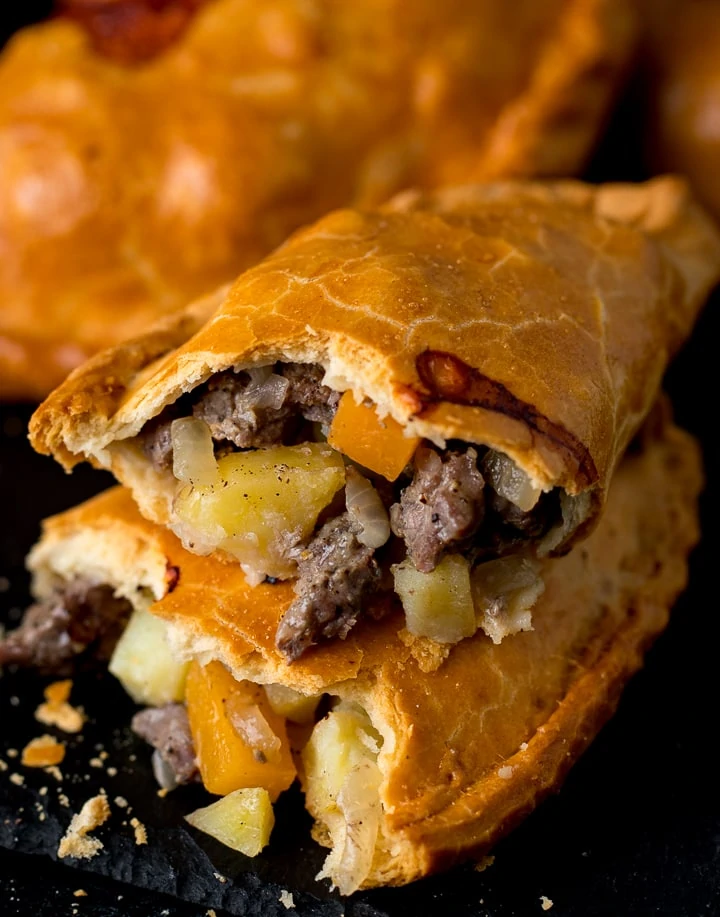 Cornish pasty broken in half to show the filling