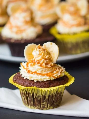 Chocolate Banana Sundae Cupcakes - with whipped cream, caramel drizzle and chopped hazelnuts. Who could resist!