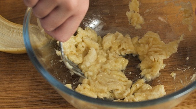 Mashing bananas in a bowl