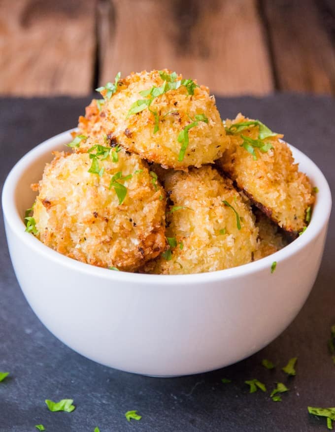 Cauliflower Arancini filled with creamy boursin cheese. Quicker and healthier than regular arancini. Baked rather than fried.