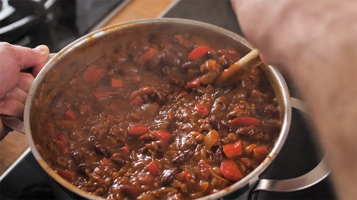 chilli con carne simmering in a pan