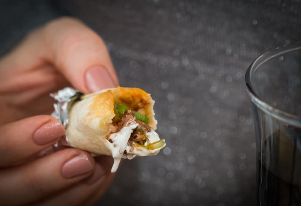 Mini burritos - A great make-ahead appetizer for parties. Prepare, wrap in foil and then reheat for 10 minutes in the oven before serving with some sour cream.