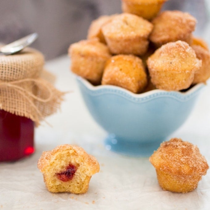 Xmas Duffins - A baked mini donut-muffin filled with homemade mulled cranberry jelly and dusted in cinnamon sugar.