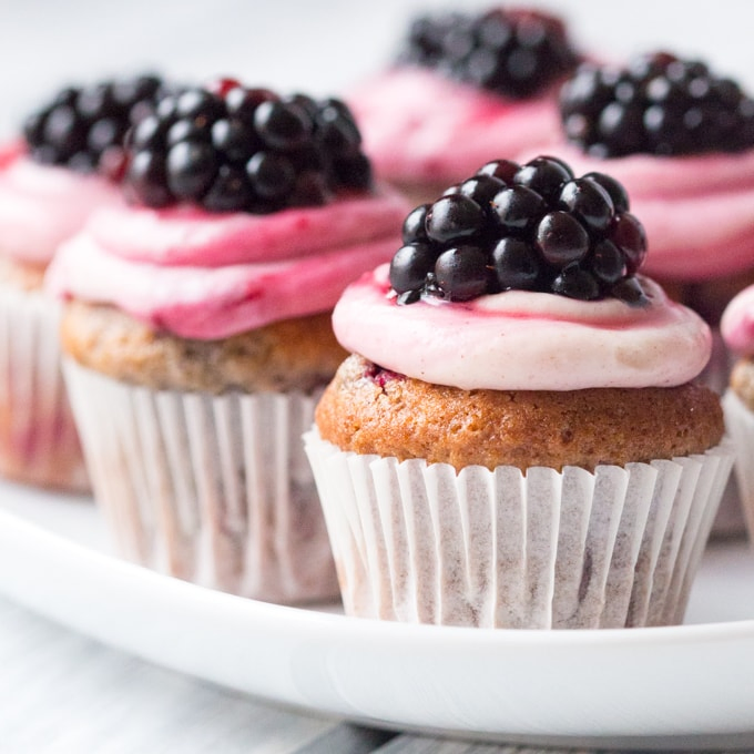 Blackberry Spice Bites - Sweet little muffin bites made with mixed spices and topped with a ginger and blackberry frosting.