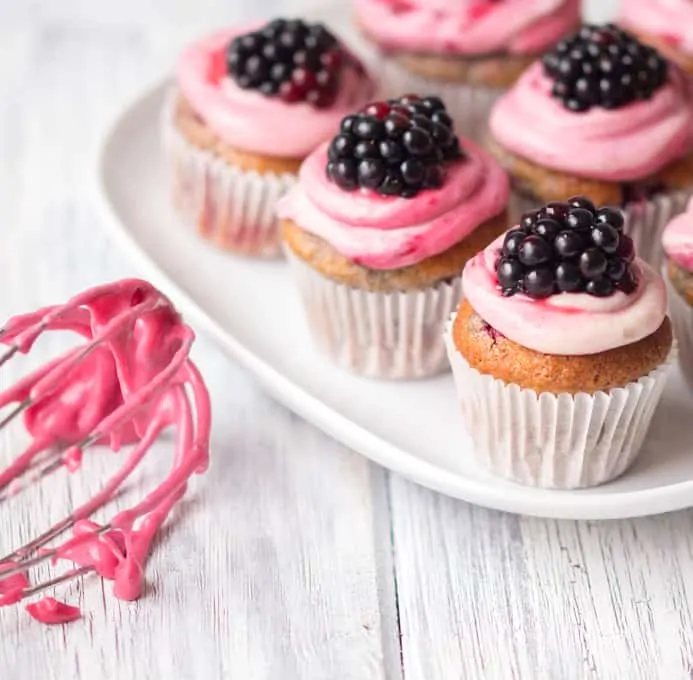 Blackberry Spice Bites - Sweet little muffin bites made with mixed spices and topped with a ginger and blackberry frosting.