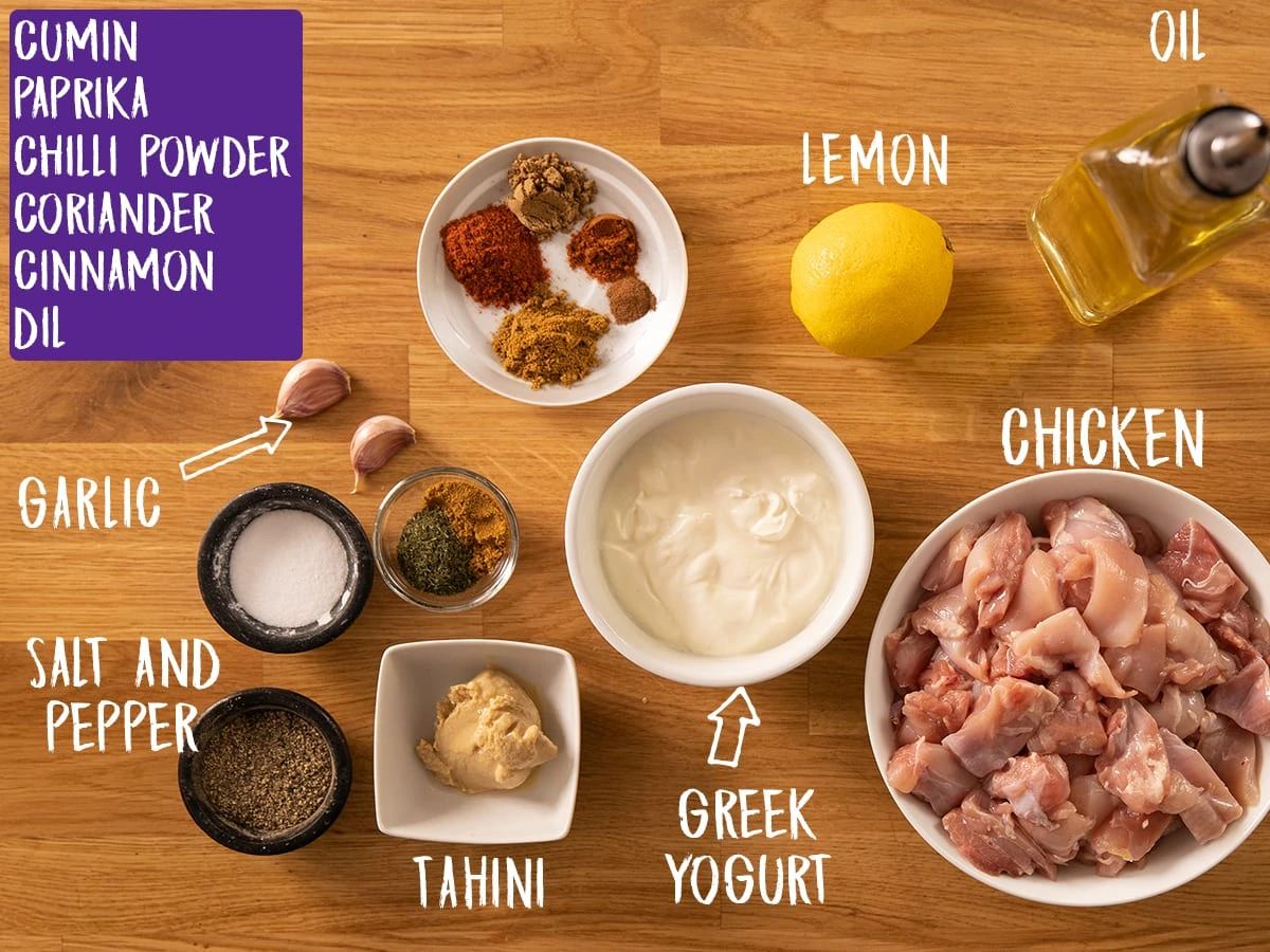 Ingredients for Chicken Shawarma on a wooden table