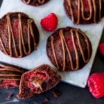 Bitesize chocolate cakes with fresh raspberry and Nutella centre, drizzled with Nutella.