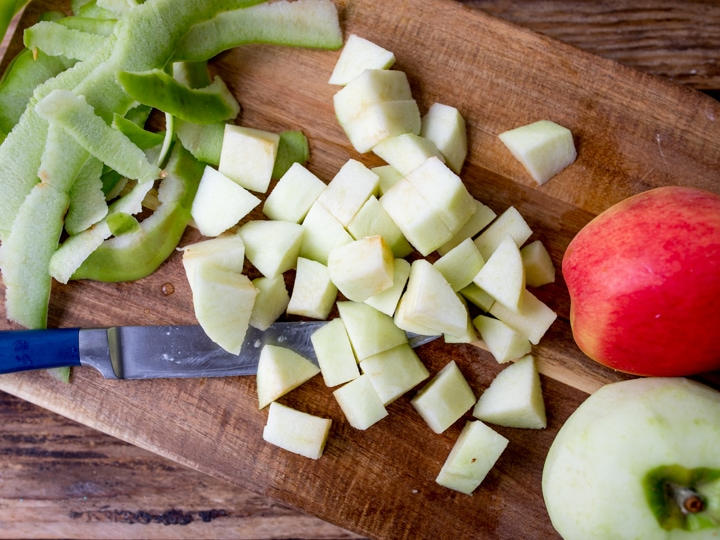 Chopping board with chopped apple chunks