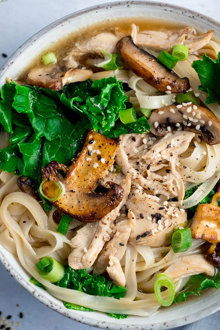 Close up overhead shot of a bowl of chicken noodle soup