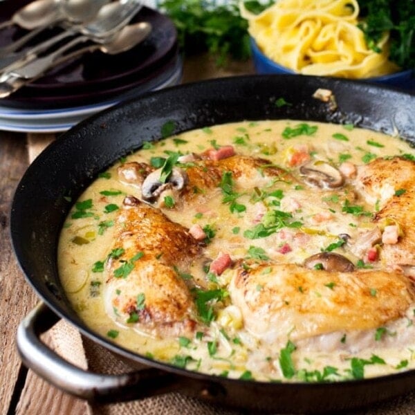 Coq au Riesling - Tender chicken cooked in a white wine sauce with mushrooms and cream.