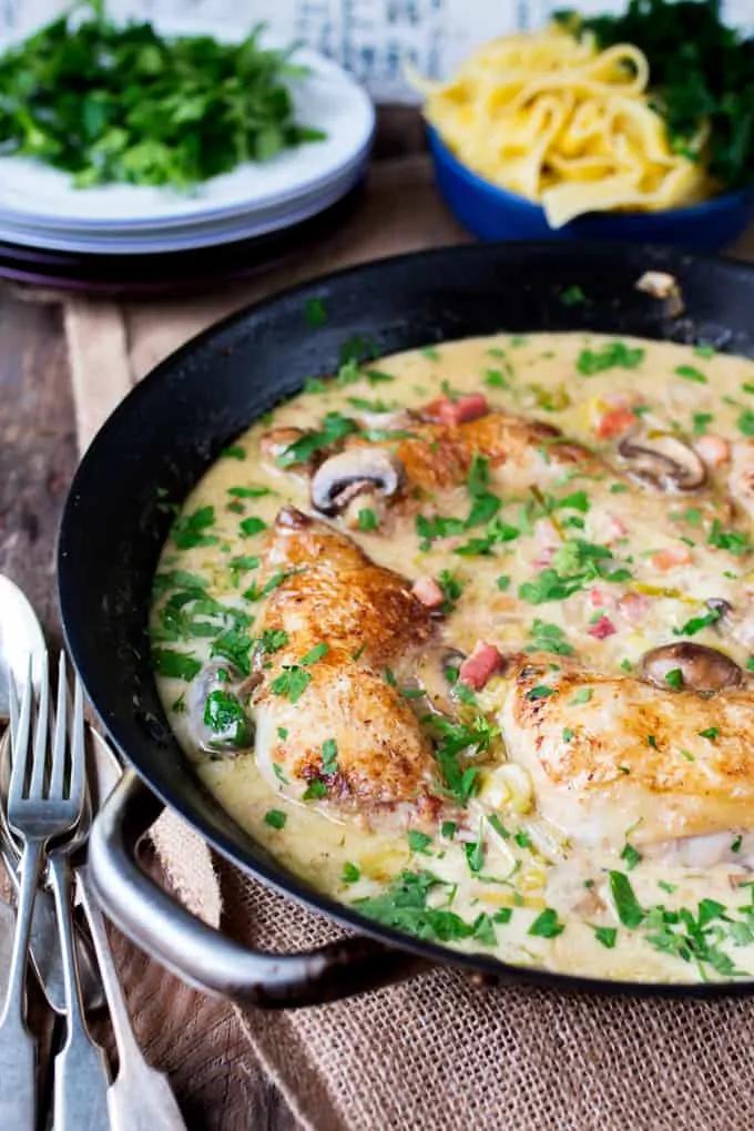 Coq au Riesling - Tender chicken cooked in a white wine sauce with mushrooms and cream.