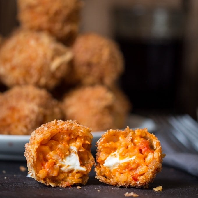 Creamy Tomato Risotto Balls, filled with creamy boursin cheese, coated in breadcrumbs and fried until golden and crisp.