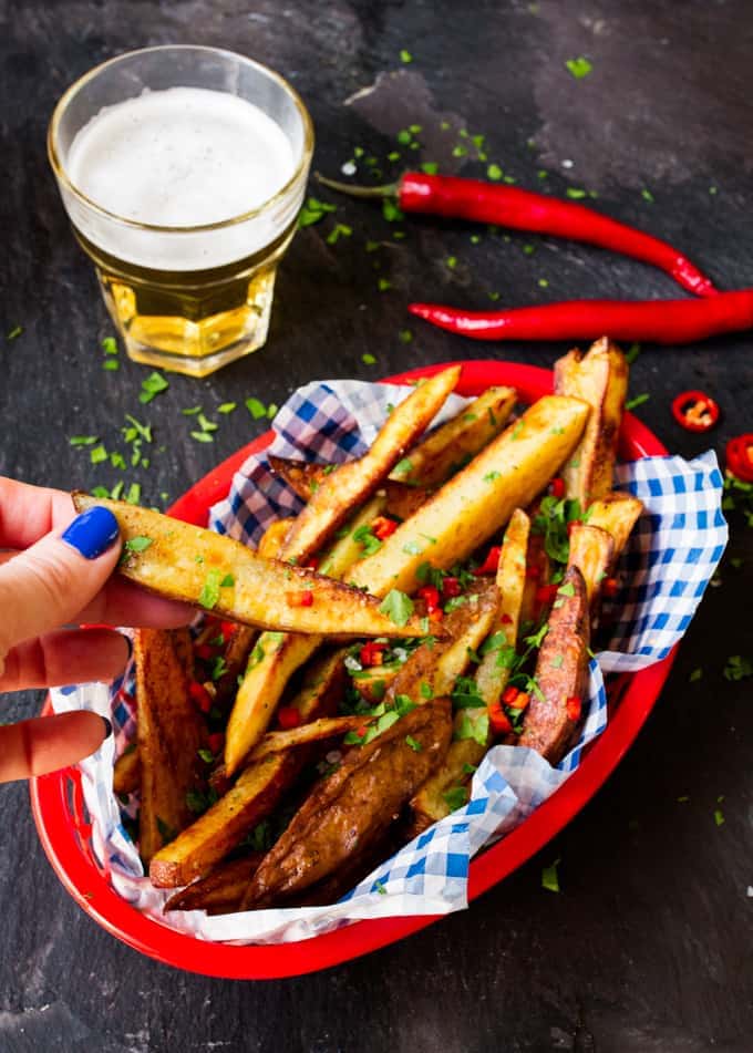 Spicy, garlicky, salty and crunchy - these garlic & chilli oven-baked fries are amazing!