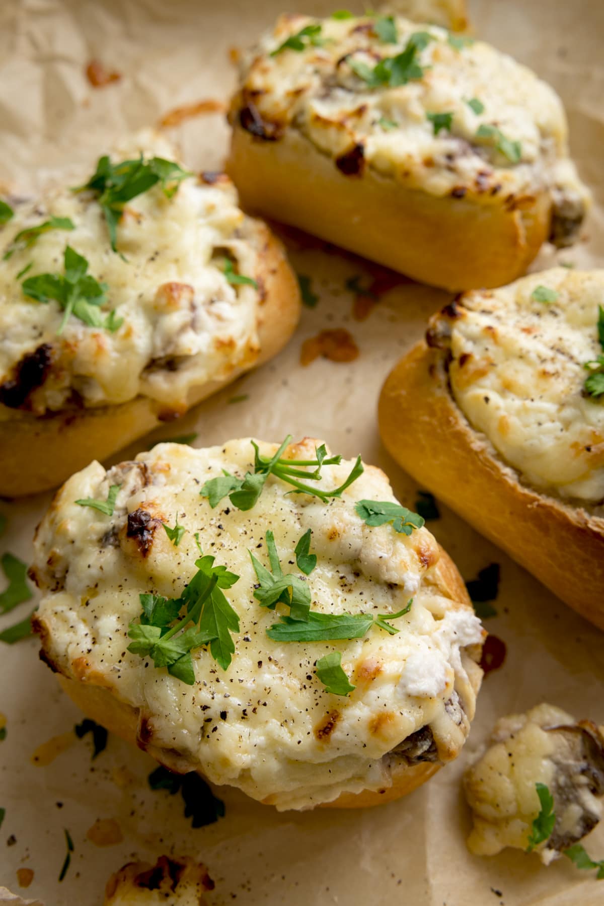 Close up of Cheesy Mushroom Stuffed Garlic Breads topped with parsley.