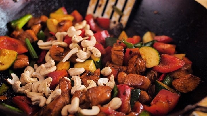 Close up of kung pao chicken in wok