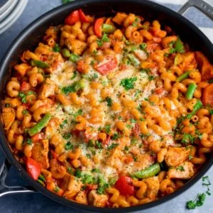 Close up of pan of cheesy chicken pasta