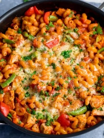 Close up of pan of cheesy chicken pasta