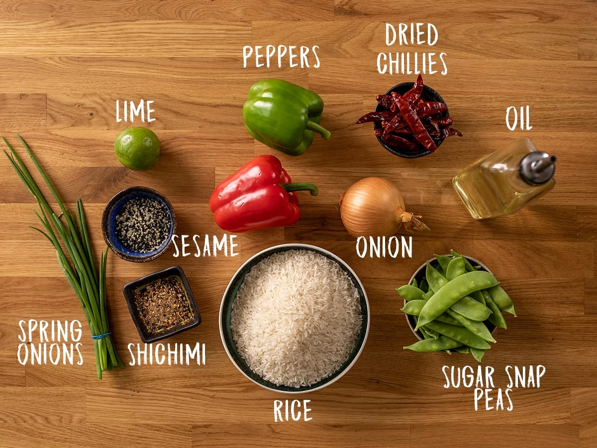 Firecracker stir fry and rice ingredients on a wooden background