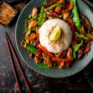 Firecracker Chicken on a blue plate against a dark background