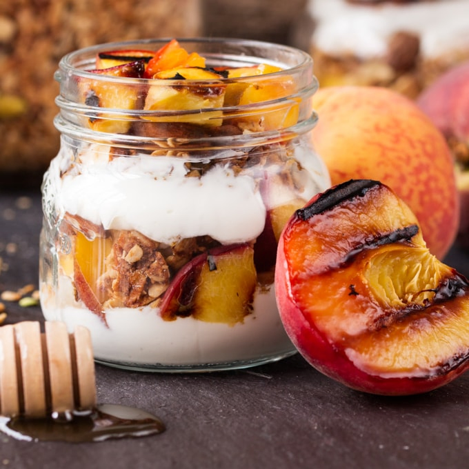 Crunchy homemade granola, layered with Greek yogurt, and caramelized peaches. Cook the peaches the night before on the residual heat from your BBQ, and you'll have the BEST breakfast the next day.