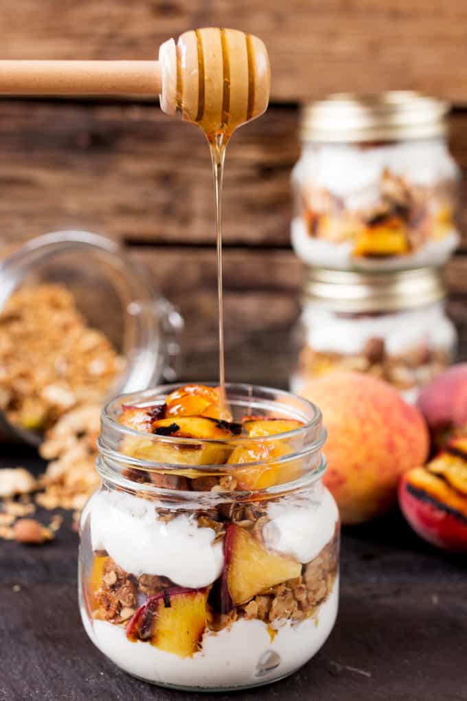 Crunchy homemade granola, layered with Greek yogurt, and caramelized peaches. Cook the peaches the night before on the residual heat from your BBQ, and you'll have the BEST breakfast the next day.