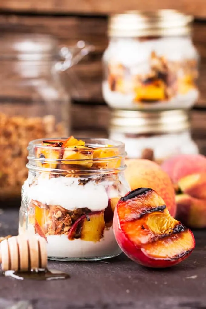 Crunchy homemade granola, layered with Greek yogurt, and caramelized peaches. Cook the peaches the night before on the residual heat from your BBQ, and you'll have the BEST breakfast the next day.