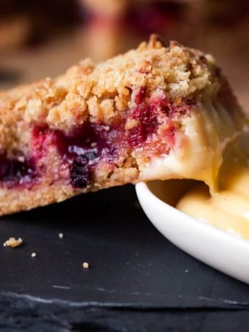 Crunchy biscuit base, juicy berry centre and buttery crumble topping served with a creamy, white chocolate custard dip. One bar is just not enough.