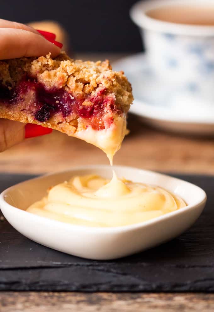Crunchy biscuit base, juicy berry centre and buttery crumble topping served with a creamy, white chocolate custard dip. One bar is just not enough.