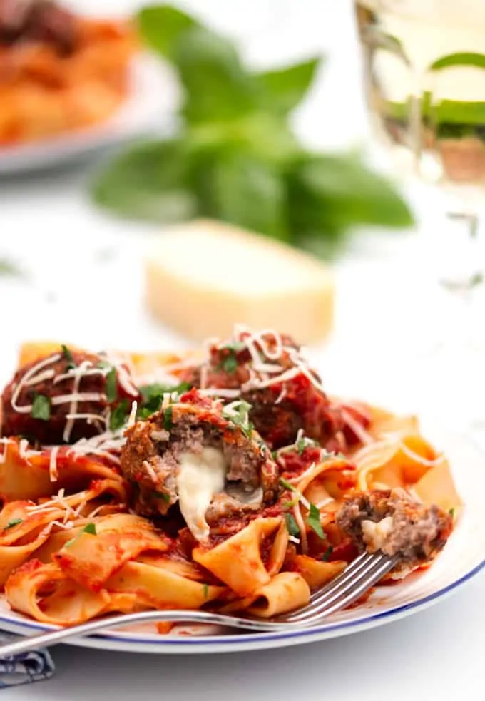 Close up of meatballs stuffed with oozy mozzarella