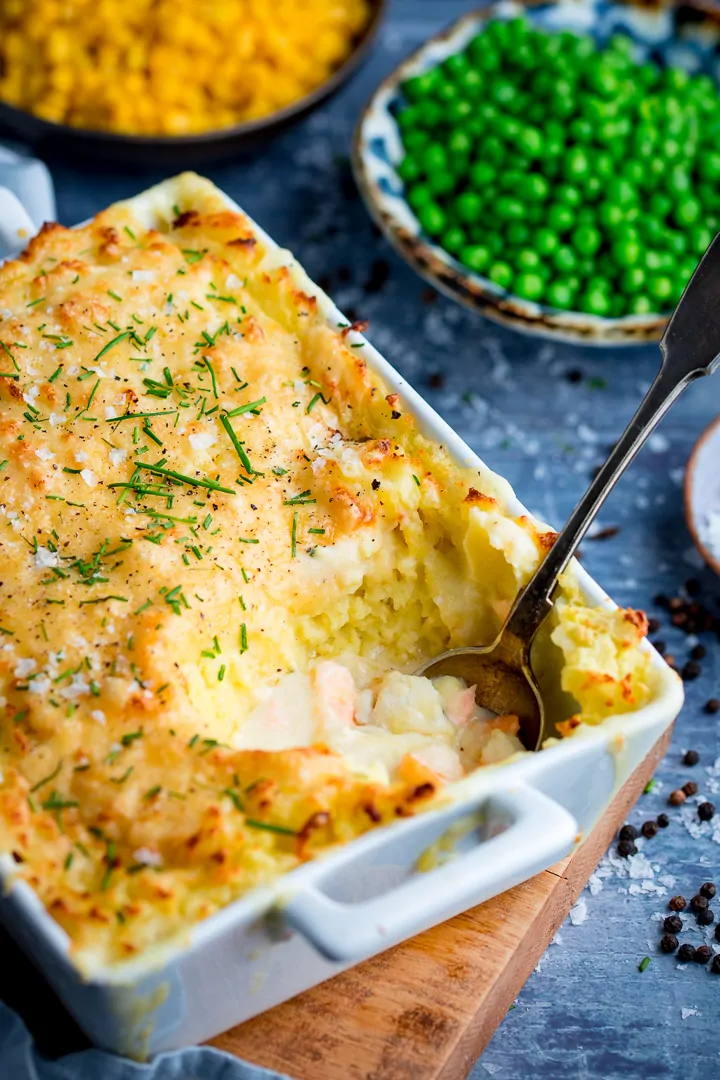 Spoonful being taken from fish pie