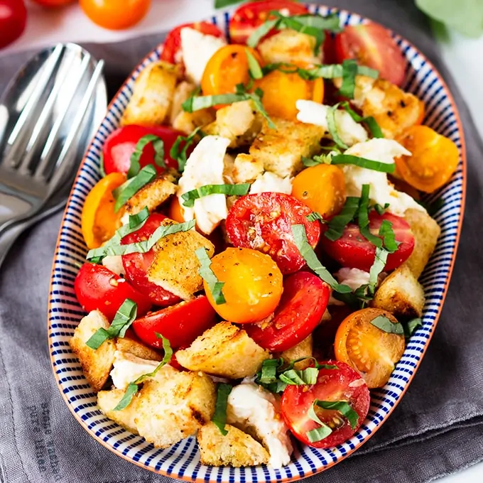 Panzanella Caprese salad. The dressing-soaked garlic croutons are what makes this salad so amazing!