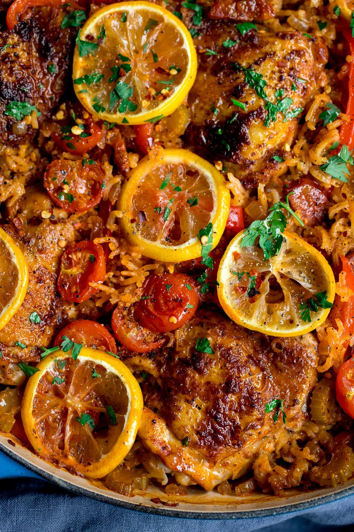Spanish chicken and rice with lemon and tomatoes in a pan