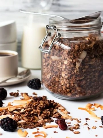 Chocolate coconut granola with cranberries - my kids love this because it turns the milk chocolatey!