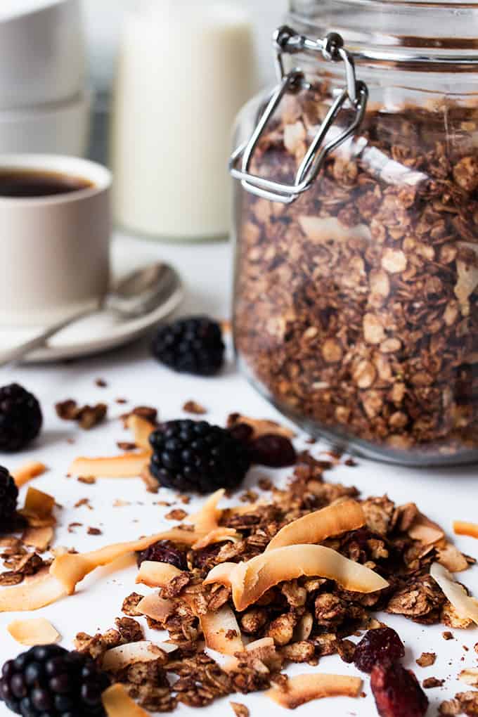 Chocolate coconut granola with cranberries on a white board