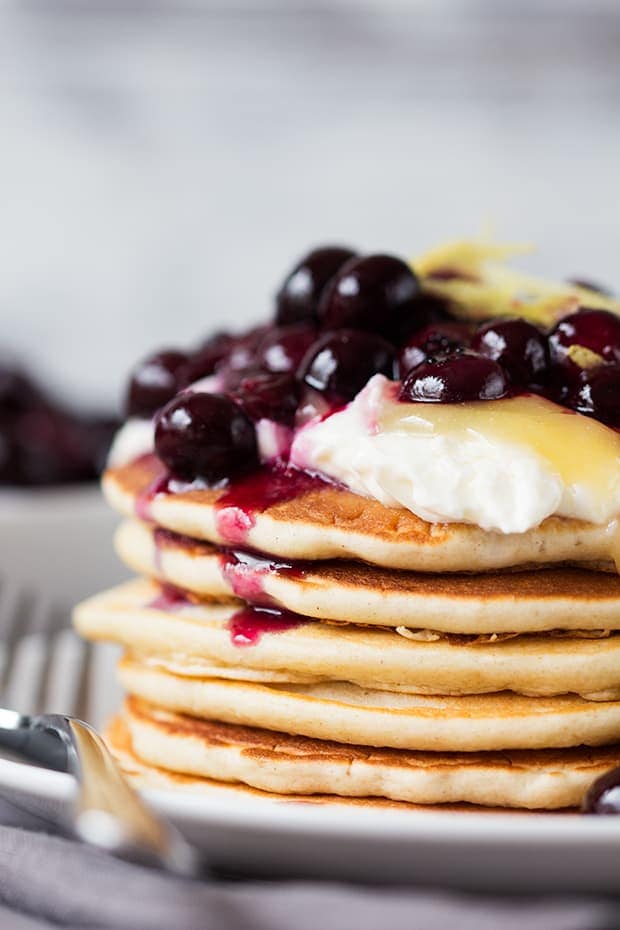 A perfectly legitimate way to have cheesecake for breakfast! These blueberry lemon cheesecake pancakes are quick, easy and amazing!