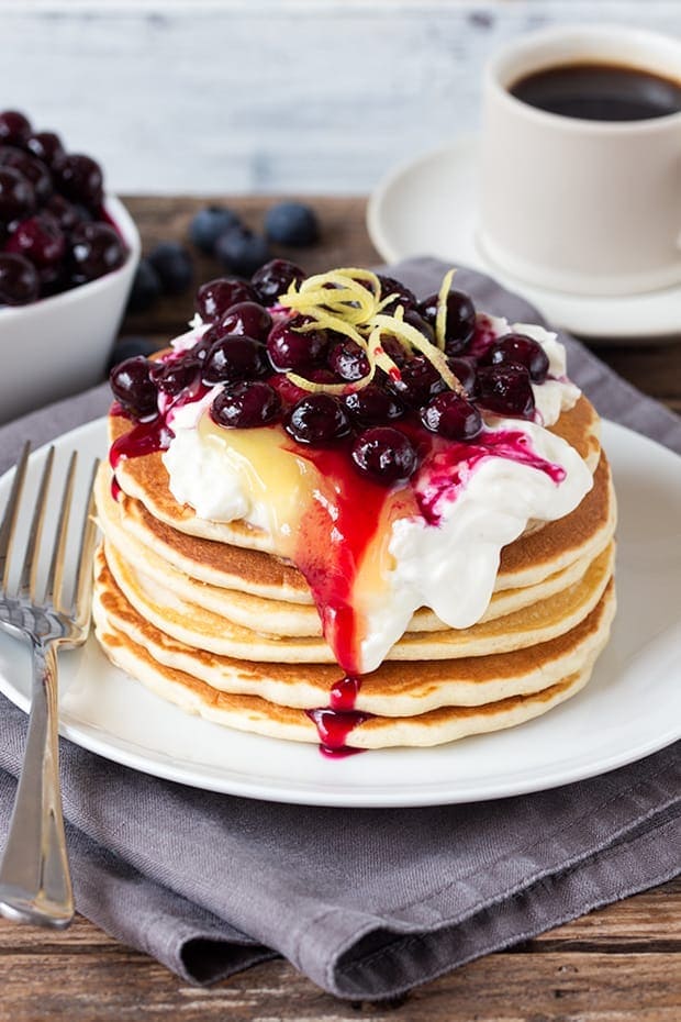 A perfectly legitimate way to have cheesecake for breakfast! These blueberry lemon cheesecake pancakes are quick, easy and amazing!