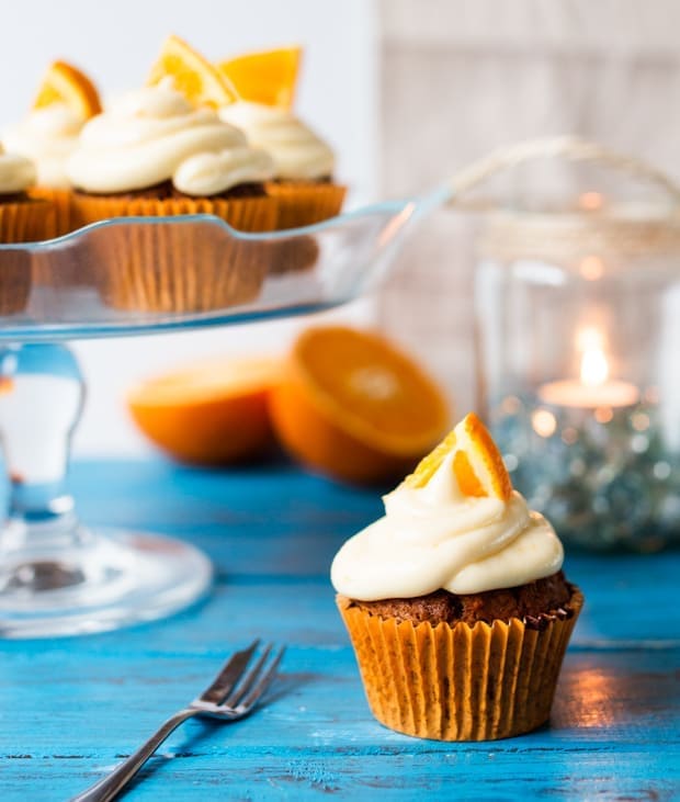 Moist and fluffy carrot & orange cupcakes with a hint of spice and lots of juicy raisins. All topped off with a zesty cream cheese frosting and orange wedges.