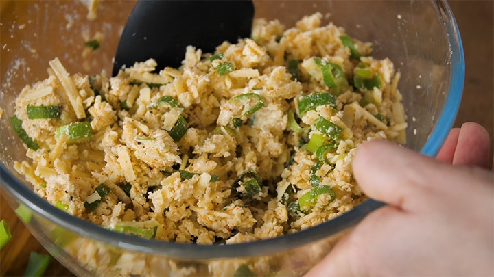 Filling for vegetarian sausage rolls being mixed in a bowl