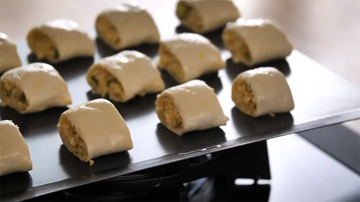 Vegetarian sausage rolls on a tray about to go in the oven