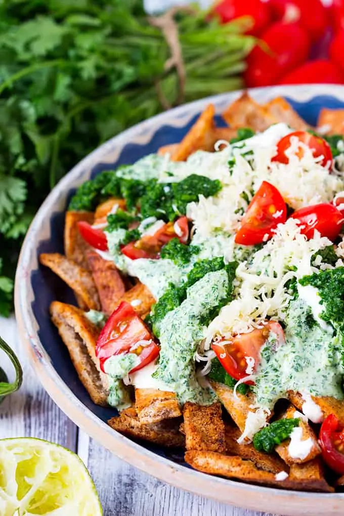 Homemade Healthy Nachos with Salsa Verde. Lot's of flavour and a touch of heat served on crunchy baked 'nachos'.