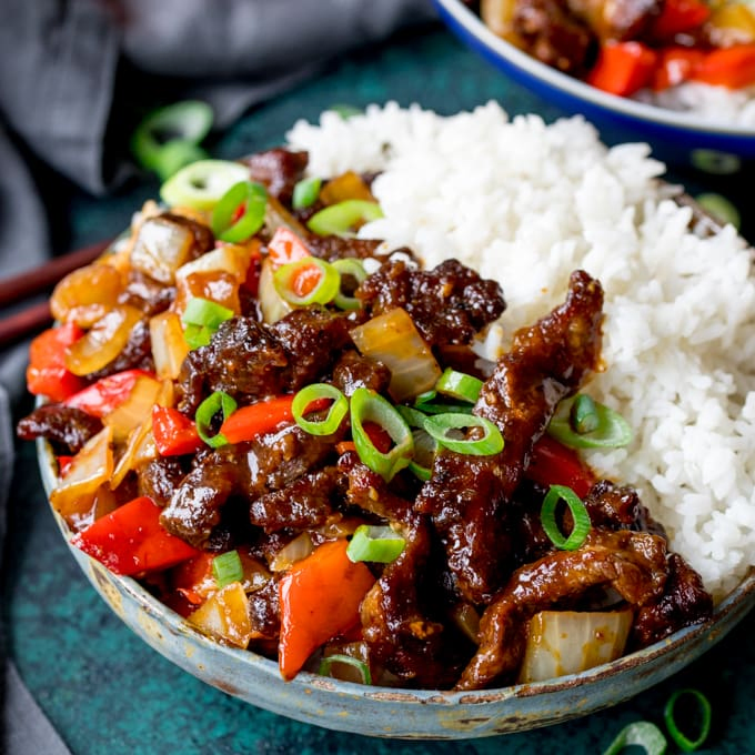 Close up of crispy orange beef with rice.