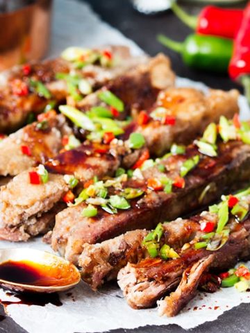These ribs are fall-apart-tender with a light, crispy coating. Drizzled in a spicy, sticky sauce they're so delicious!
