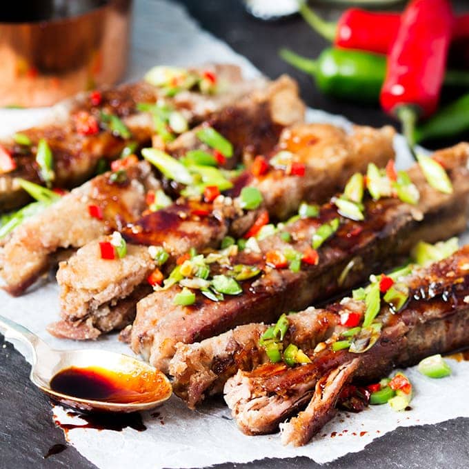These ribs are fall-apart-tender with a light, crispy coating. Drizzled in a spicy, sticky sauce they're so delicious!